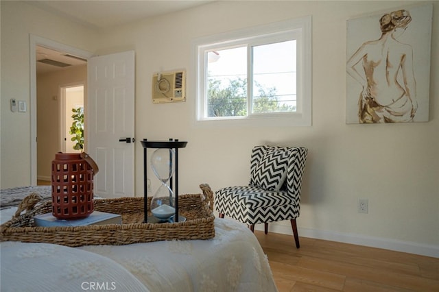 bedroom with light wood-style floors and baseboards