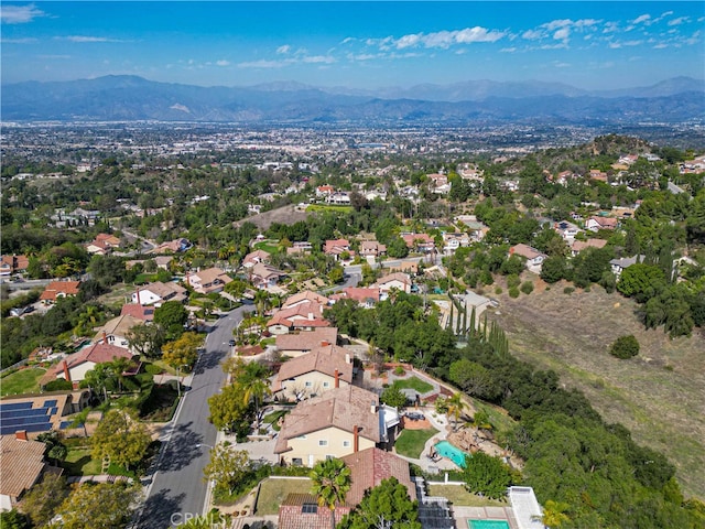 birds eye view of property with a residential view and a mountain view