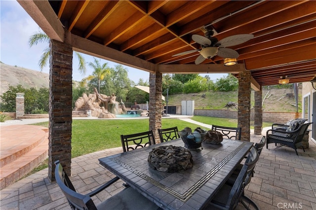 view of patio / terrace with ceiling fan and outdoor dining space