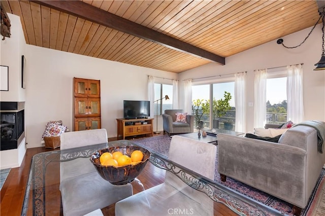 living room featuring wood ceiling, vaulted ceiling with beams, a multi sided fireplace, and wood finished floors