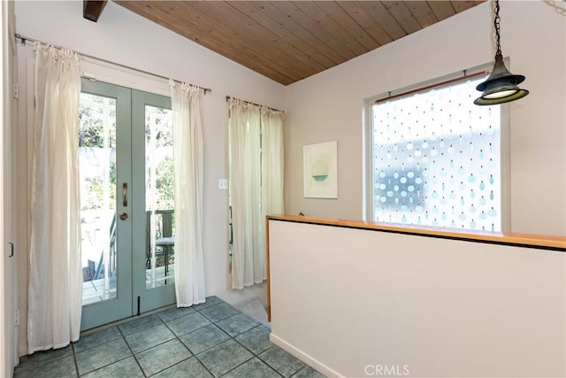 entryway with lofted ceiling, french doors, tile patterned flooring, and wood ceiling