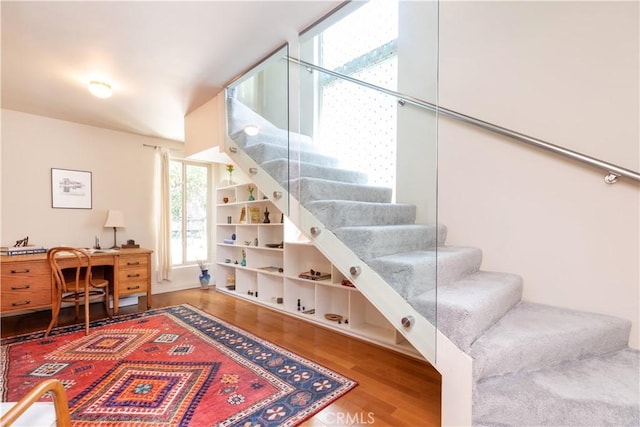 stairway with wood finished floors