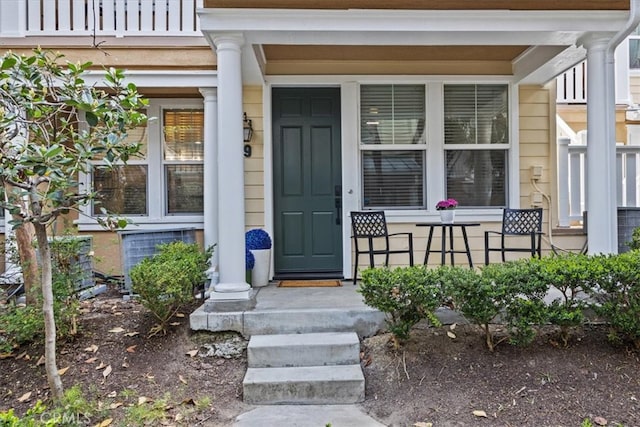 view of exterior entry with covered porch