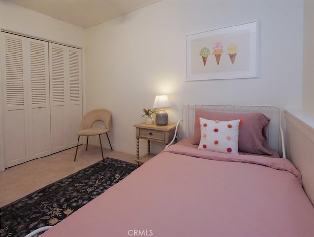 carpeted bedroom with a closet