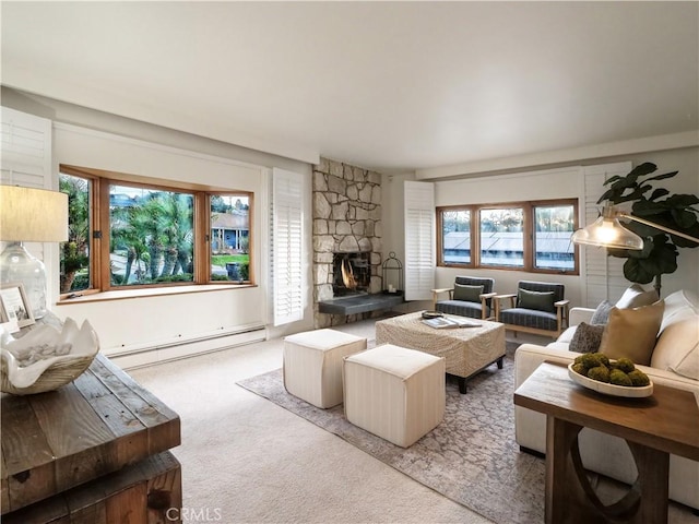 carpeted living room featuring baseboard heating and a fireplace