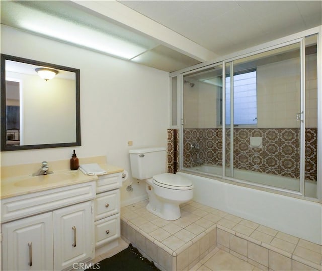 bathroom with bath / shower combo with glass door, vanity, and toilet