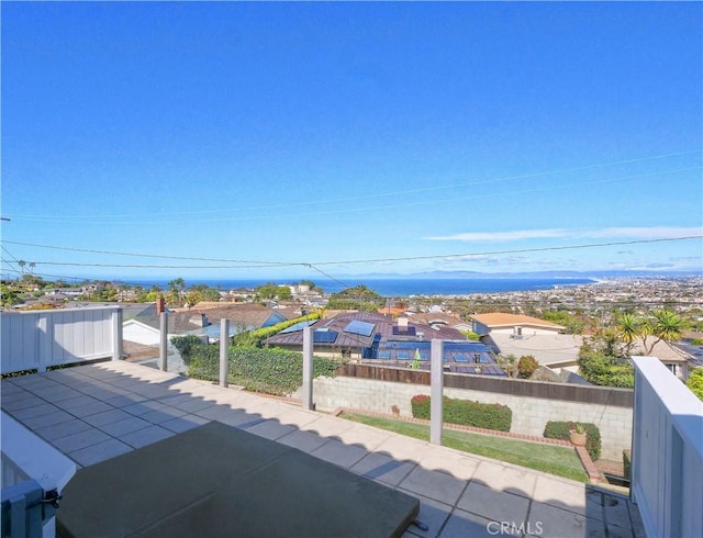 view of patio / terrace featuring a residential view and fence