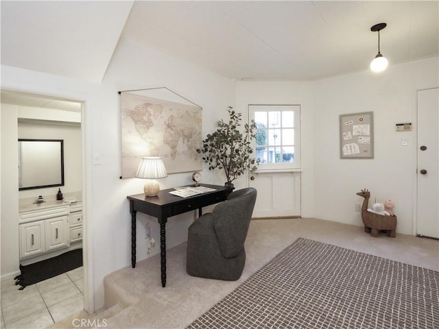 office with light carpet and light tile patterned floors