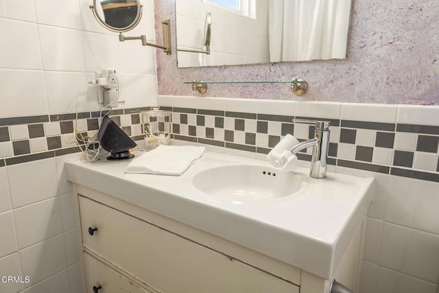 bathroom featuring tile walls and vanity