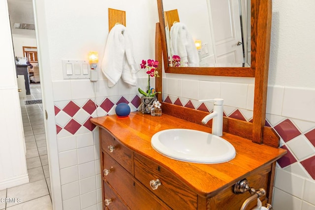 bathroom with vanity, tile walls, and wainscoting