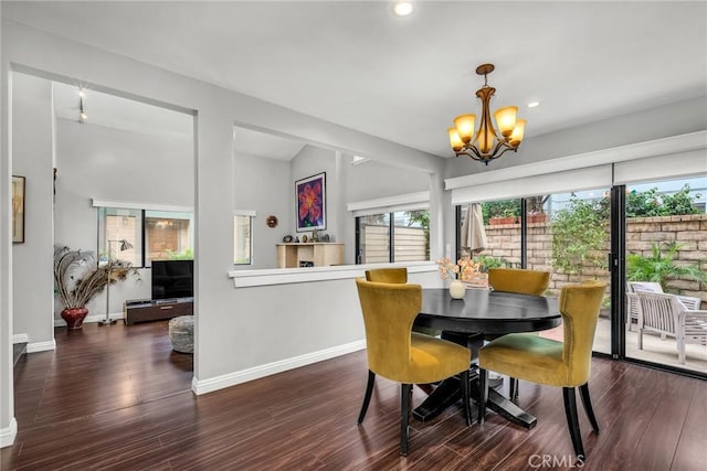 dining room with baseboards, recessed lighting, wood finished floors, and a notable chandelier