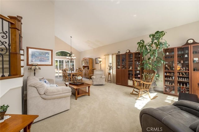 23 Landing, Laguna Niguel, CA 92677 - carpeted living room with a chandelier and high vaulted ceiling