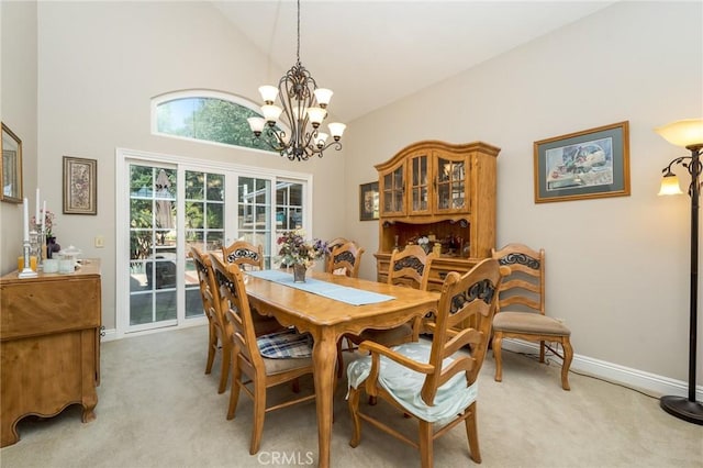 23 Landing, Laguna Niguel, CA 92677 - dining room featuring light carpet, a chandelier, and high vaulted ceiling
