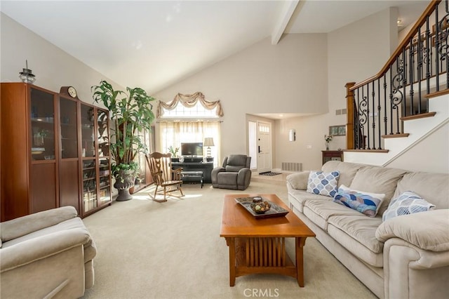 23 Landing, Laguna Niguel, CA 92677 - carpeted living area with high vaulted ceiling, beamed ceiling, and stairs