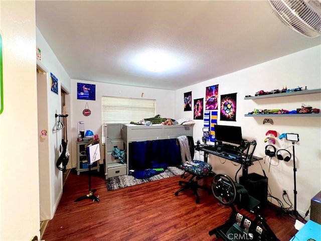 bedroom featuring wood finished floors and visible vents