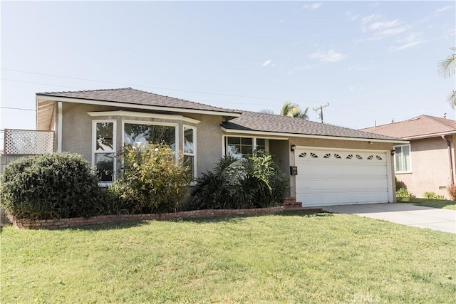 view of front of property with driveway, a shingled roof, stucco siding, an attached garage, and a front yard