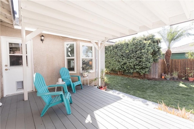 deck with fence and a lawn