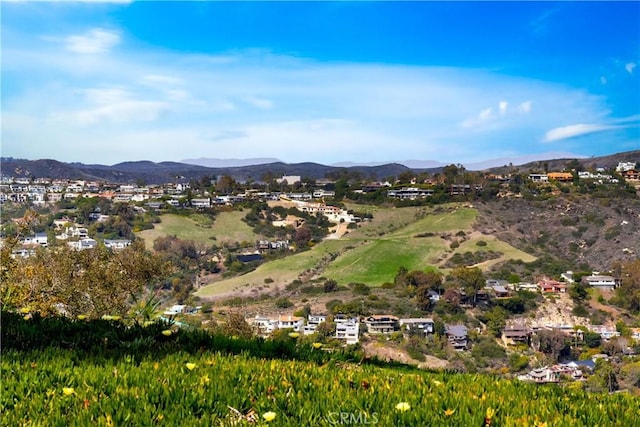 drone / aerial view with a mountain view and a residential view