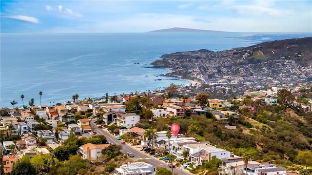 drone / aerial view with a water view and a residential view