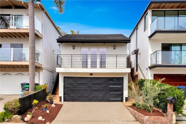 modern home with a garage, driveway, and stucco siding