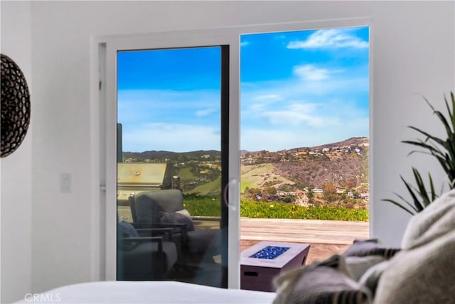 doorway to outside with a mountain view