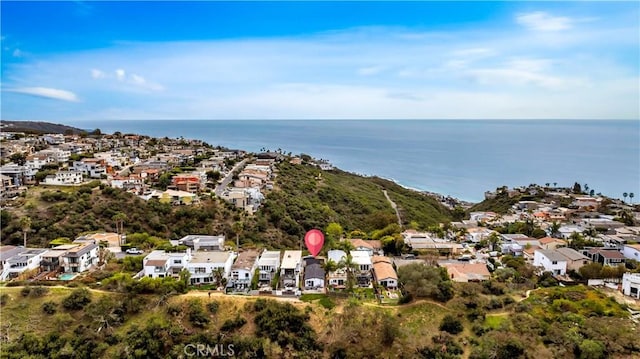 birds eye view of property with a water view and a residential view