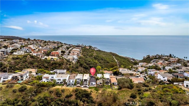 drone / aerial view with a residential view and a water view