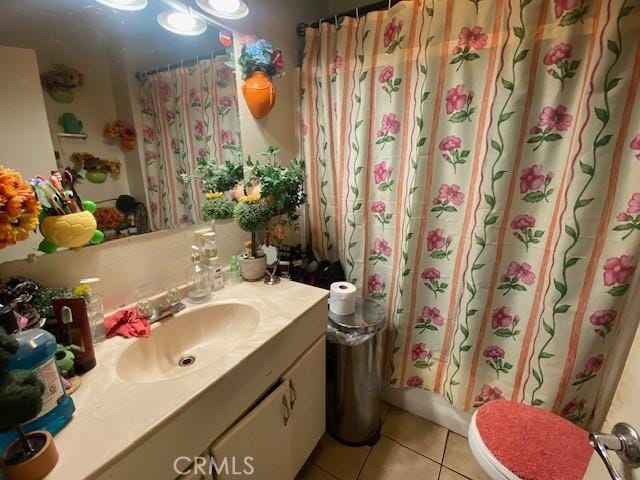 bathroom with tile patterned flooring, shower / bath combination with curtain, toilet, and vanity