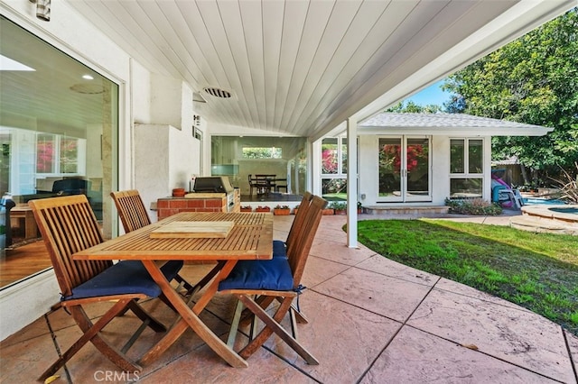 view of patio featuring area for grilling and outdoor dining space