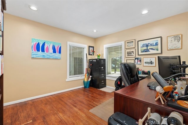 office featuring baseboards, wood finished floors, and recessed lighting