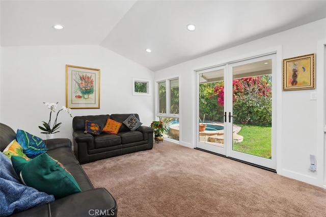 carpeted living area featuring recessed lighting, baseboards, vaulted ceiling, and french doors