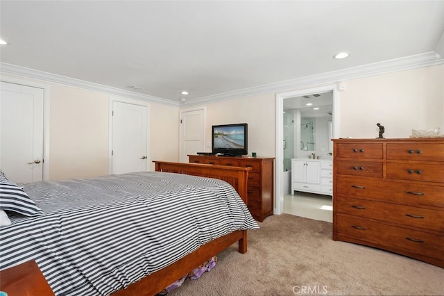 bedroom featuring recessed lighting, visible vents, ornamental molding, light carpet, and connected bathroom