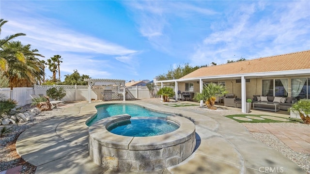 view of pool featuring a pool with connected hot tub, a pergola, a fenced backyard, an outdoor hangout area, and a patio area