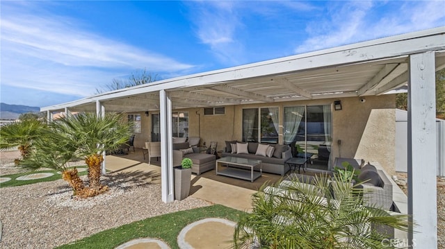 view of patio with an outdoor living space and a pergola