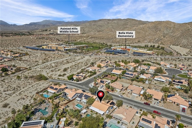 aerial view featuring a desert view and a mountain view