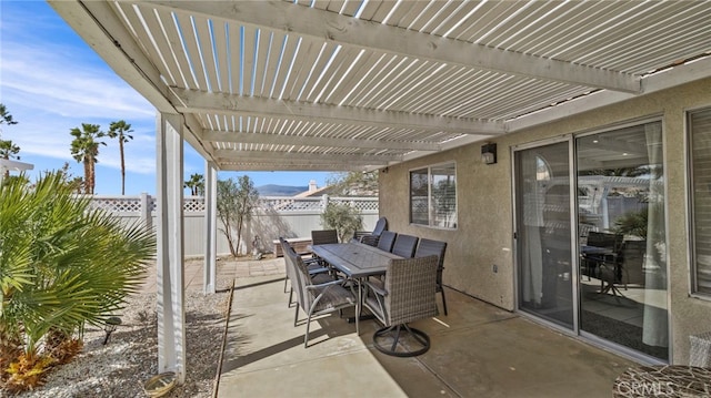 view of patio with a pergola, outdoor dining area, and a fenced backyard