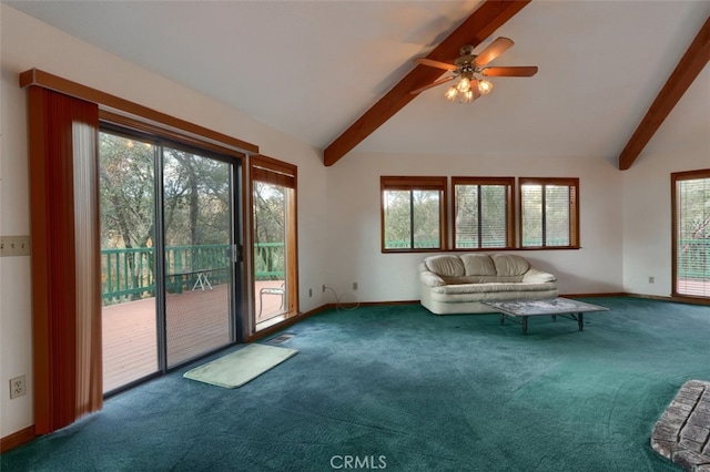 unfurnished living room with carpet floors, a healthy amount of sunlight, vaulted ceiling with beams, and baseboards