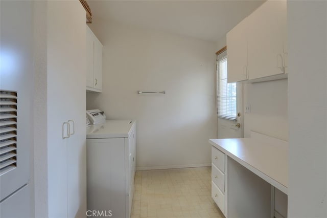 laundry room with baseboards, cabinet space, and washing machine and clothes dryer