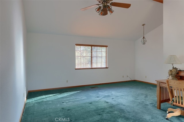 carpeted spare room with vaulted ceiling, a ceiling fan, and baseboards