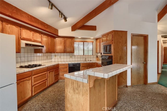 kitchen with tile counters, lofted ceiling with beams, backsplash, under cabinet range hood, and black appliances