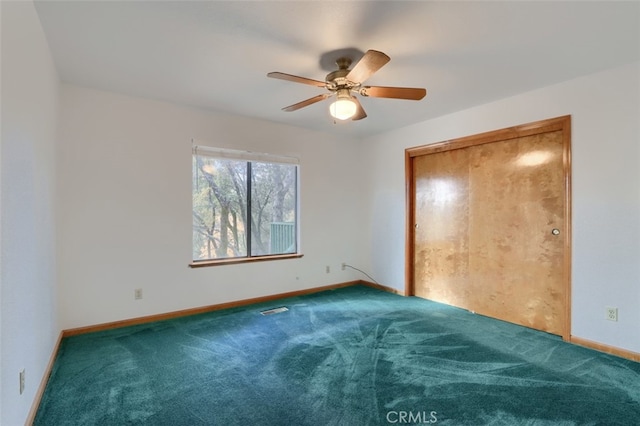 unfurnished bedroom featuring carpet, visible vents, and baseboards