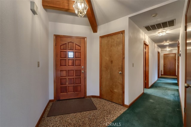 entrance foyer featuring carpet, visible vents, beamed ceiling, and baseboards