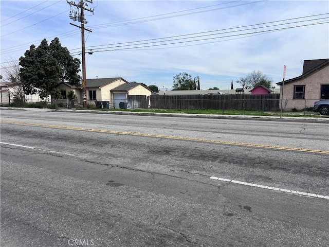 view of road with curbs and sidewalks