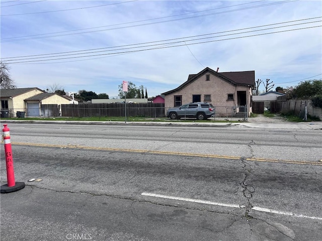 view of road with sidewalks and curbs