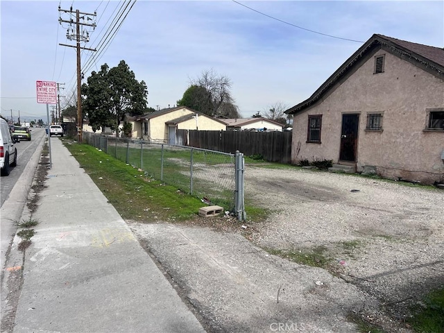 view of road with entry steps and sidewalks