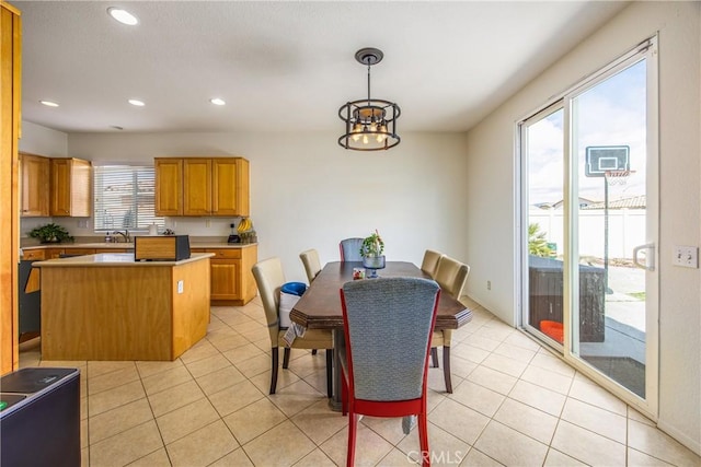 dining area with light tile patterned floors and recessed lighting