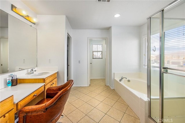 full bath featuring tile patterned floors, visible vents, an enclosed shower, a garden tub, and vanity