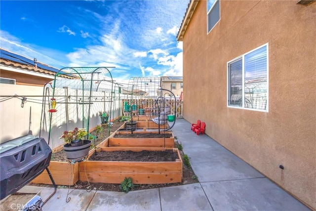 view of yard featuring a garden and fence