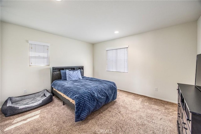 bedroom featuring recessed lighting, multiple windows, baseboards, and carpet