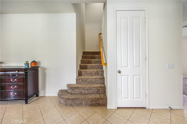 stairs with tile patterned floors